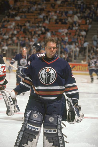 Curtis Joseph skating in Edmonton Oilers goaltending equipment in March 1997
