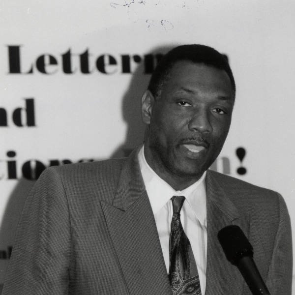 Elvin Hayes speaking into a microphone
