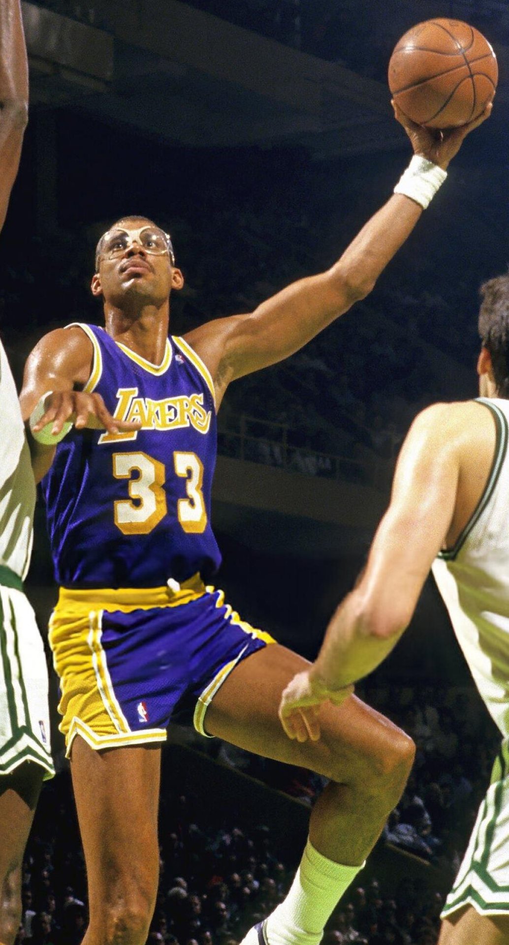 Kareem Abdul-Jabbar extending for a right-handed layup