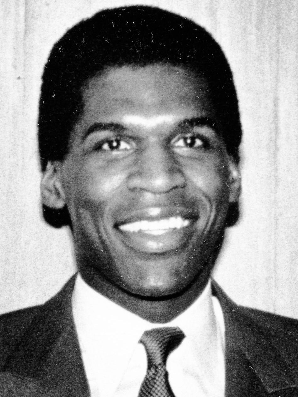 A black-and-white portrait of Robert Parish