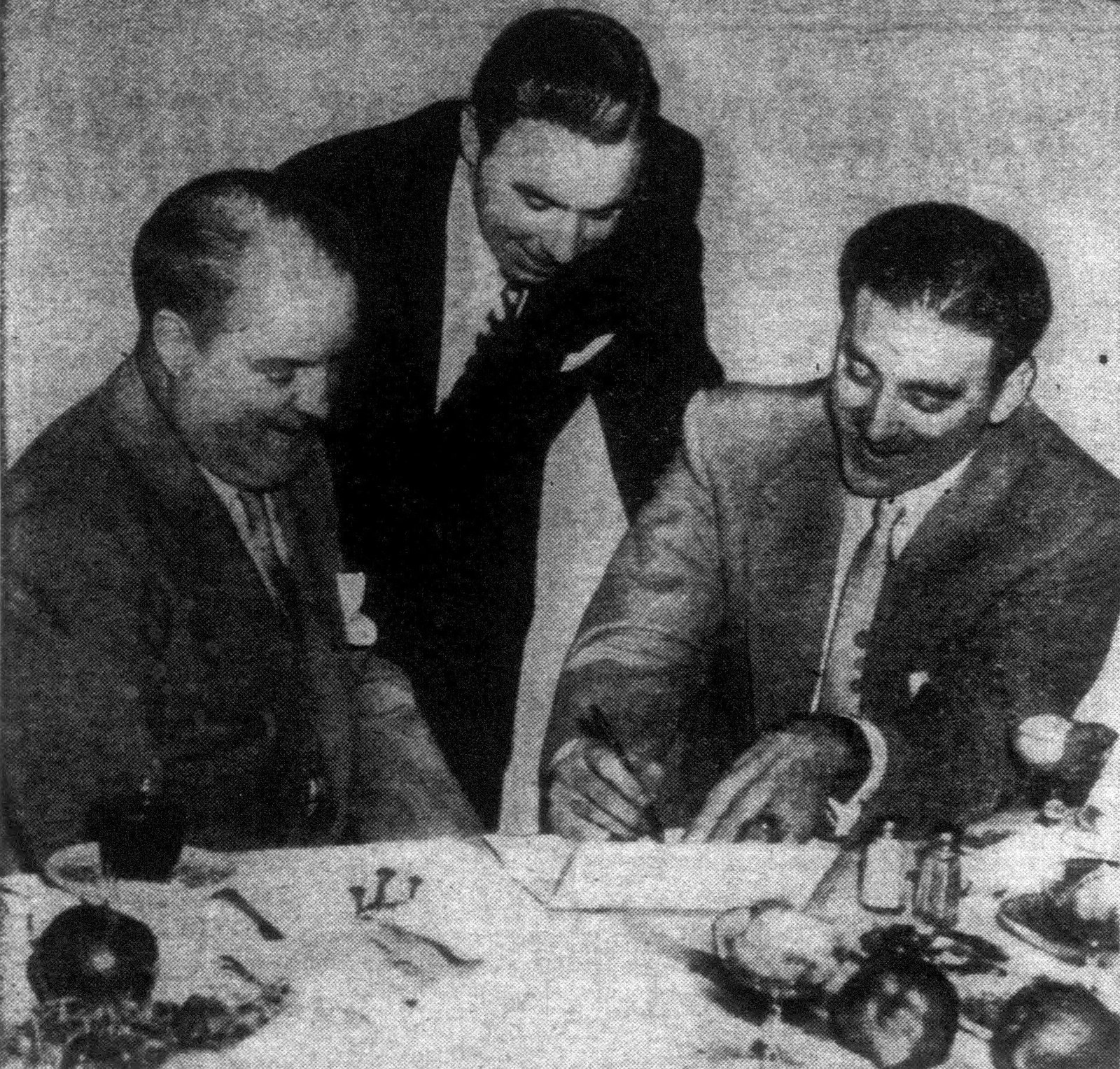 New York Giants owner Horace Stoneham and pitcher Sal Maglie sign a baseball contract in 1953 as Pee Wee Reese watches