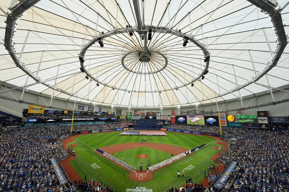 Tampa Bay Rays and Chicago Cubs players line the field inside Tropicana Field