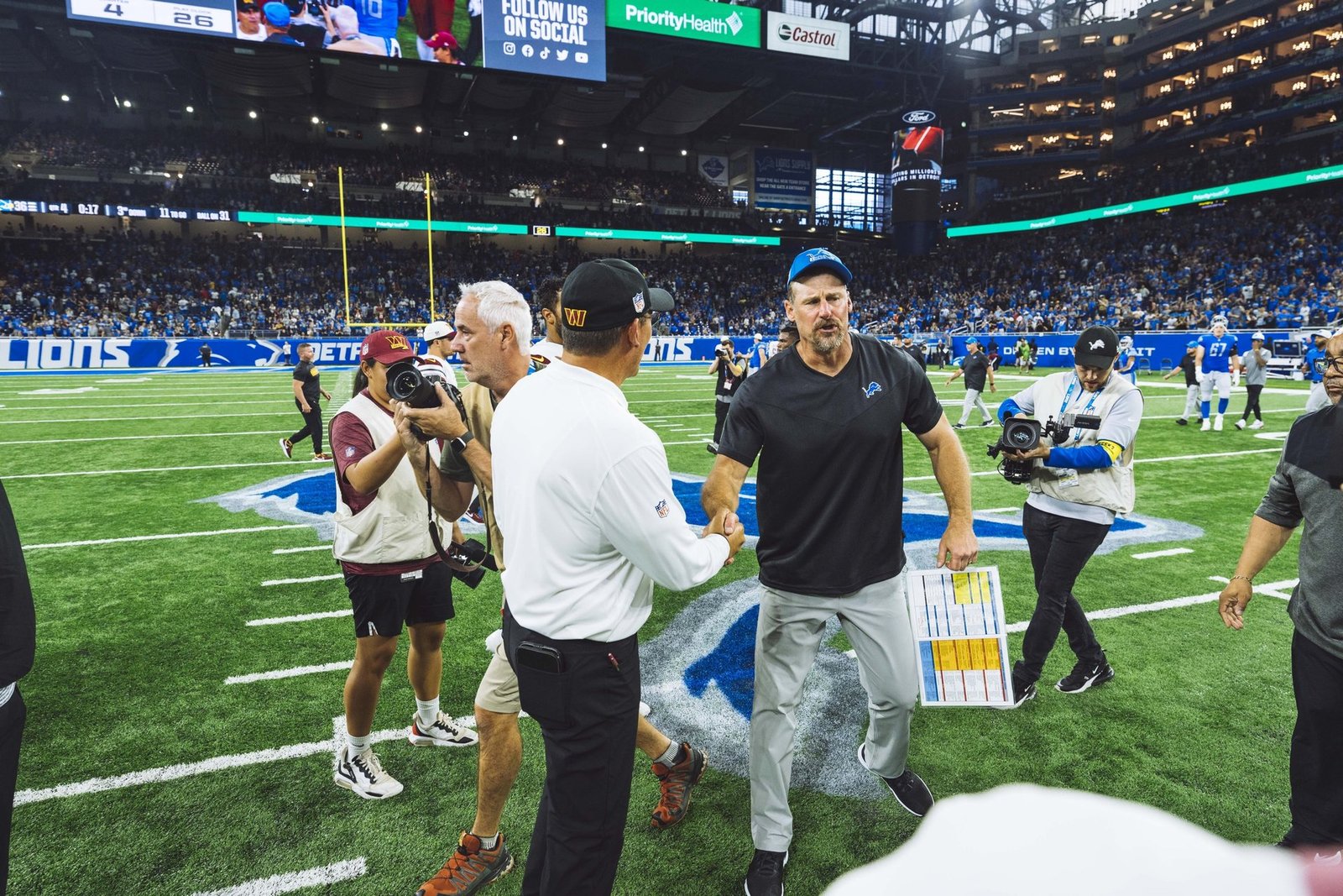 Detroit Lions head coach Dan Campbell on the field after a game