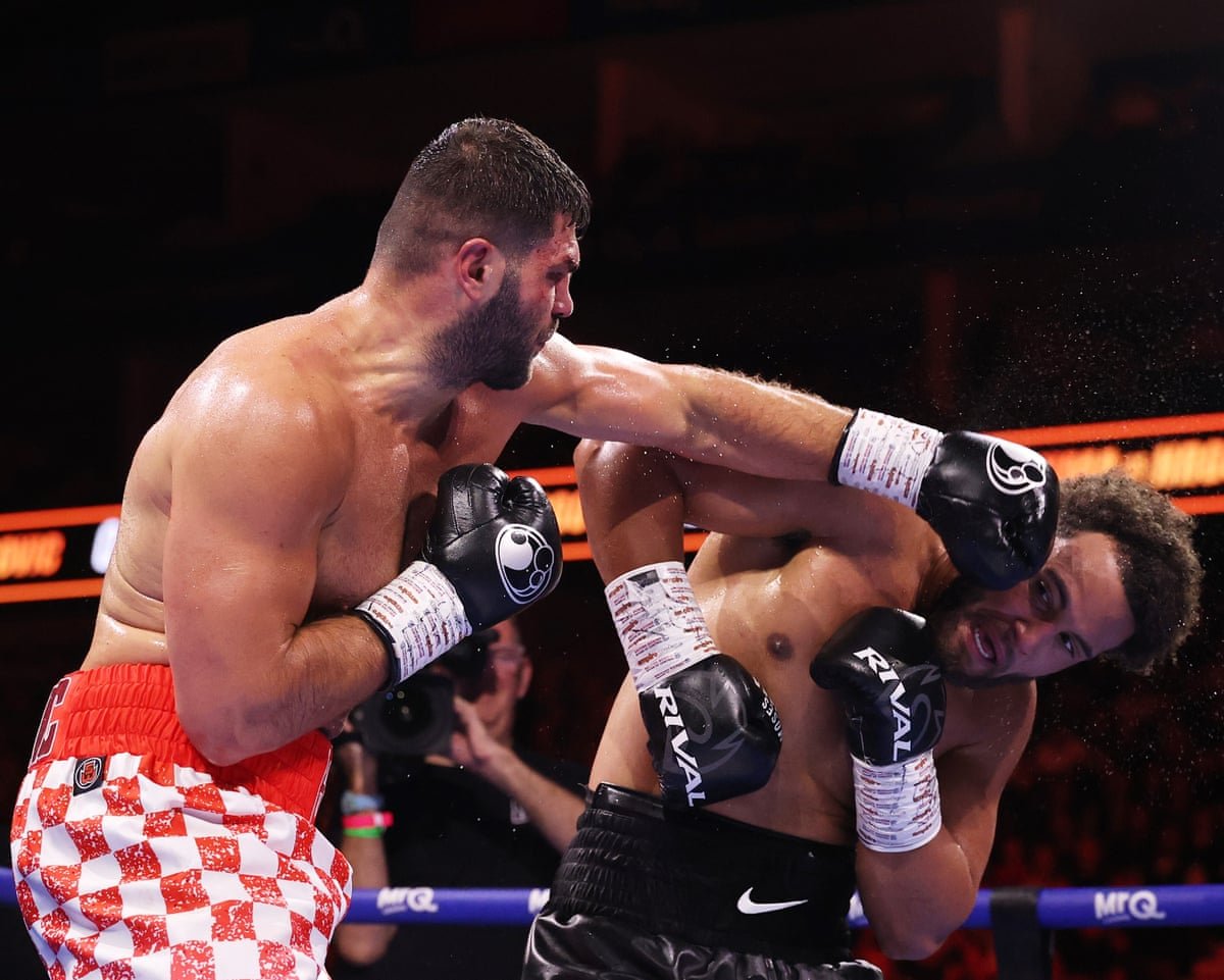 Filip Hrgović lands a right hand on Moses Itauma during their IBF heavyweight title fight