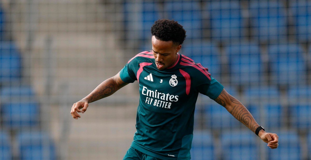Éder Militão in Real Madrid training kit working with the ball.