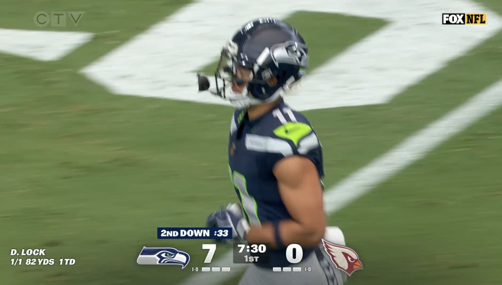 Jaxon Smith-Njigba in Seattle’s No. 11 jersey during the first quarter against Arizona, with the Seahawks leading 7–0.