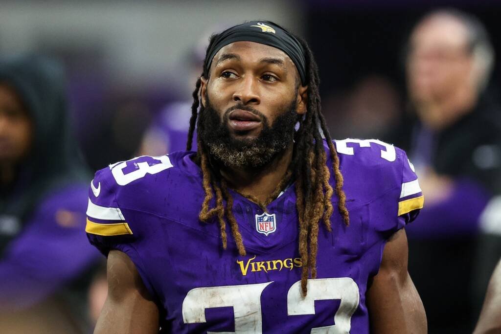 Minnesota Vikings running back Aaron Jones carries the ball during a game.