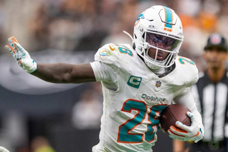 File photo: De’Von Achane carries the ball for Miami. NFL.com published this image with its September 28, 2026 injury report; capture date not supplied.