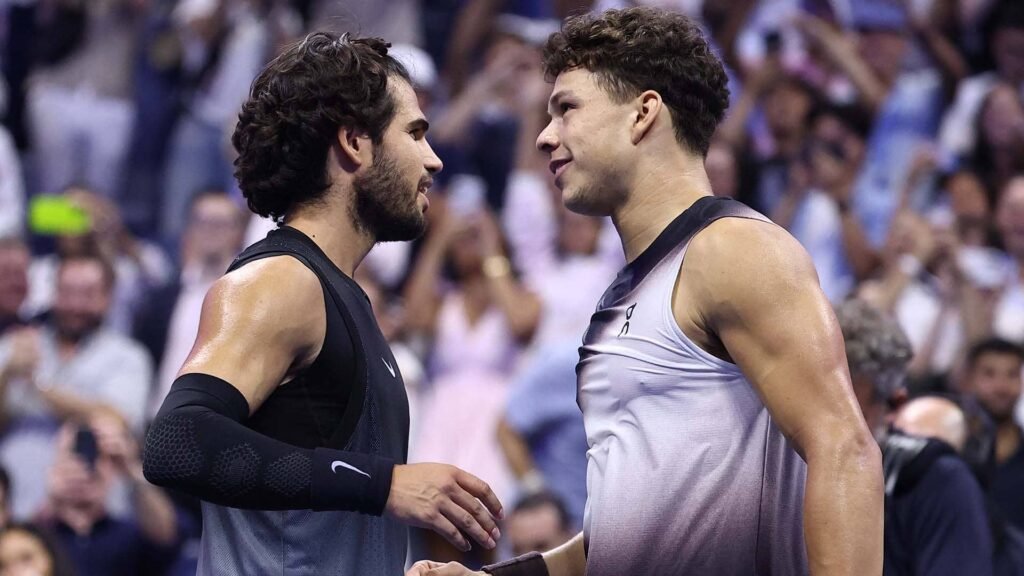Carlos Alcaraz and Ben Shelton at the net after their 2026 US Open quarterfinal.
