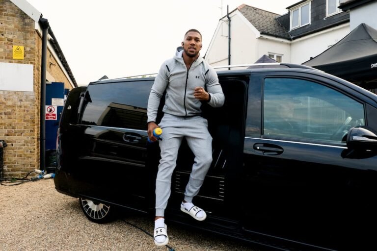 Anthony Joshua beside a minibus after arriving in London for the Tyson Fury fight launch on September 29, 2026