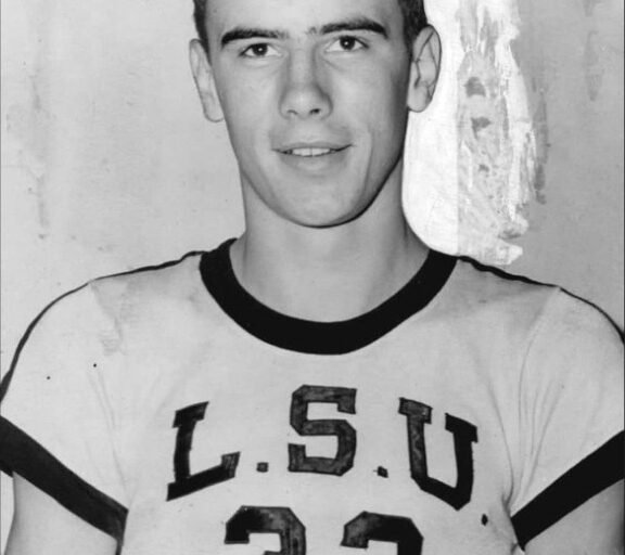 Bob Pettit wearing an LSU basketball jersey.