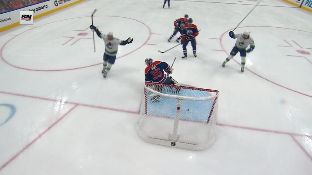 Vancouver players celebrate Paul Cotter’s goal against Edmonton at Rogers Place on September 29, 2026. Sportsnet broadcast still via ESPN.
