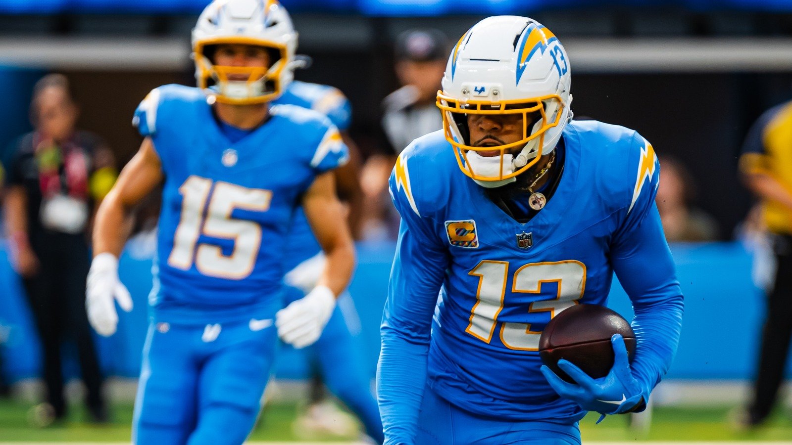 Keenan Allen carries the football for the Los Angeles Chargers during the 2025 season.