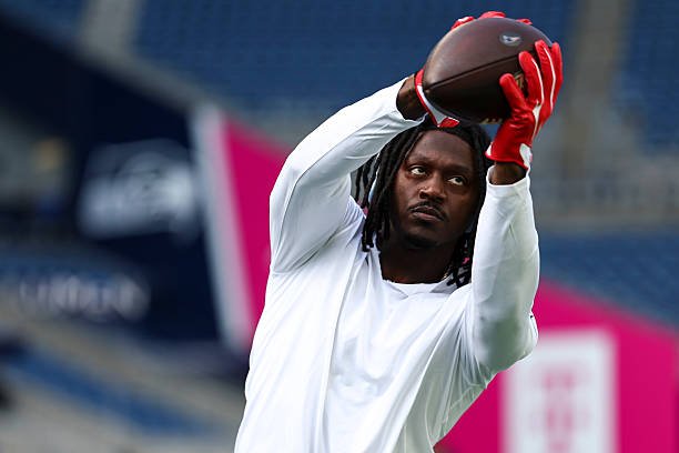 A.J. Brown catches a football during warmups before the New England Patriots’ game against the Seattle Seahawks at Lumen Field.