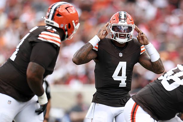 Deshaun Watson raises both hands beside his helmet during Cleveland’s game against Tampa Bay.