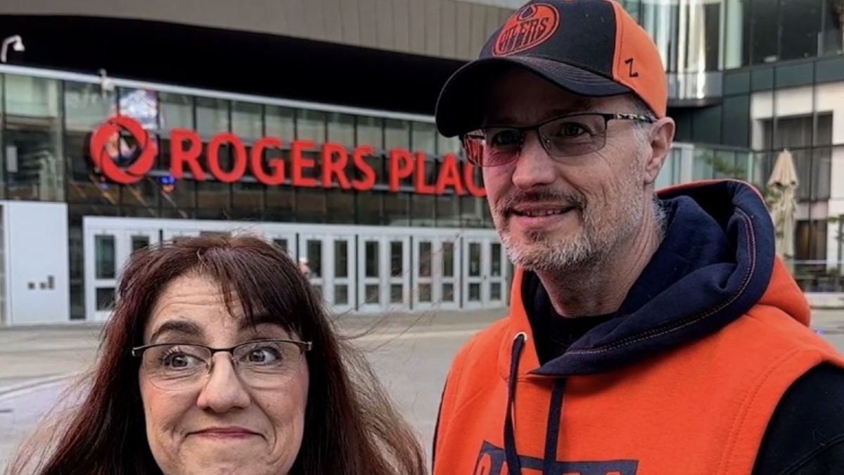 Two Edmonton Oilers fans interviewed outside Rogers Place for a CBC News report on hockey viewing costs.