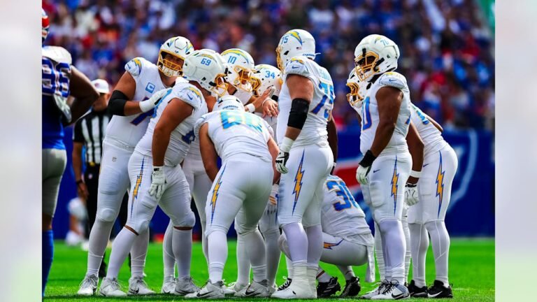 Justin Herbert, number 10, in the Chargers offensive huddle against the Buffalo Bills on September 27, 2026