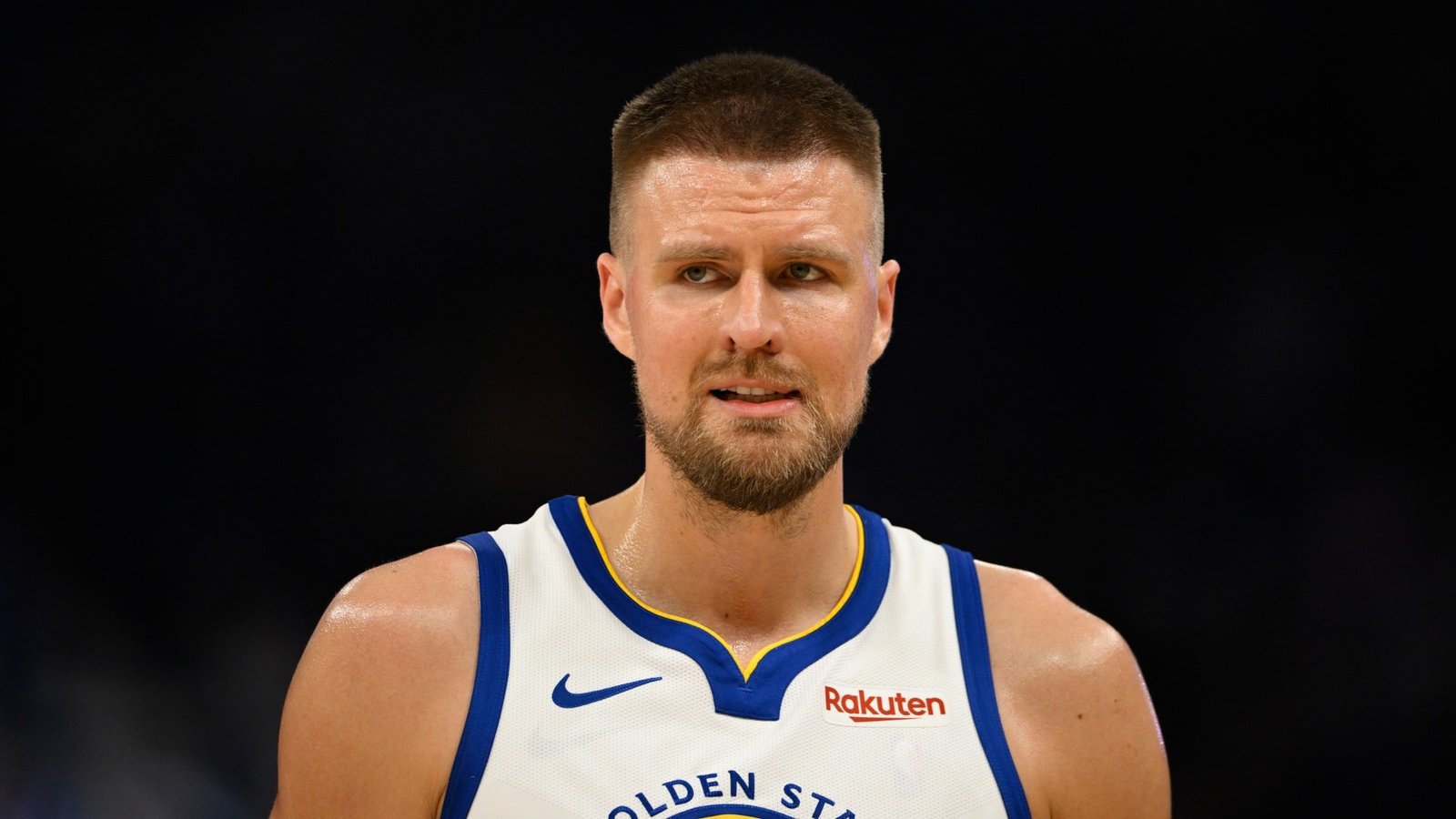 Kristaps Porzingis wearing a Golden State Warriors uniform