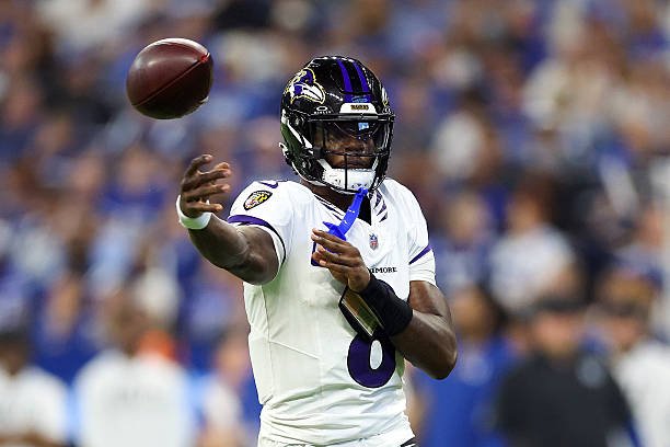 Lamar Jackson releases a pass in the Ravens’ white road uniform during Baltimore’s Week 1 game in Indianapolis.