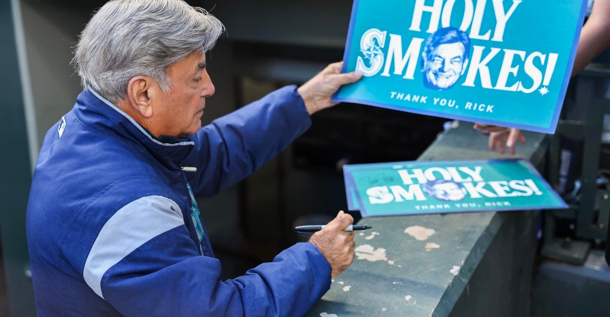 Rick Rizzs signs autographs before his final Mariners broadcast at T-Mobile Park on September 27, 2026.