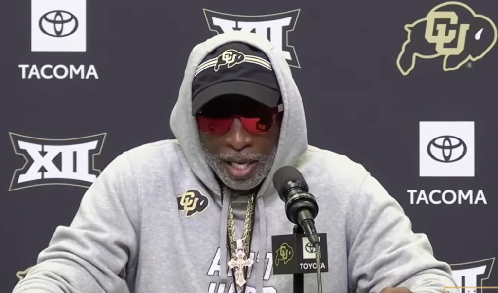 Colorado coach Deion Sanders speaking at a press conference