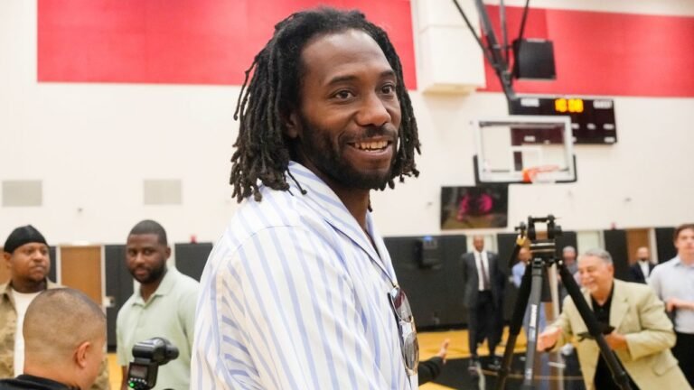 Kawhi Leonard attends Kyle Lowry’s retirement press conference in Toronto.