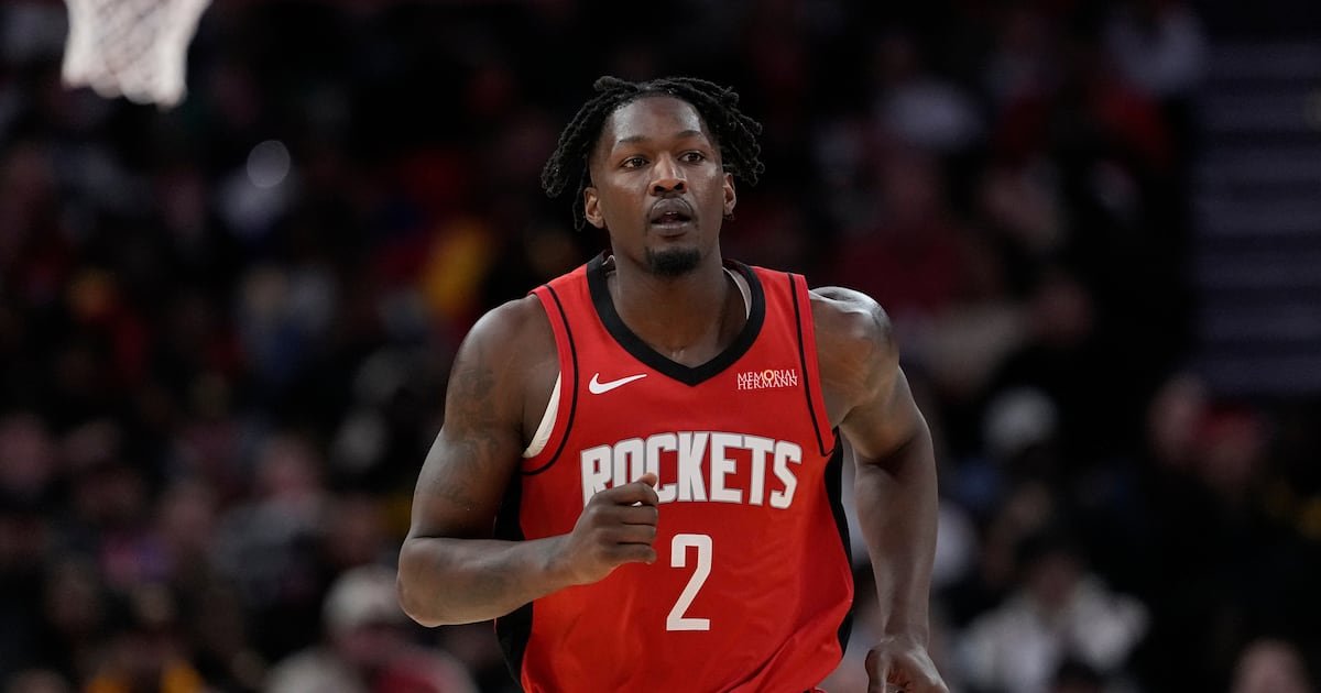 Dorian Finney-Smith appears in his red Houston Rockets uniform.