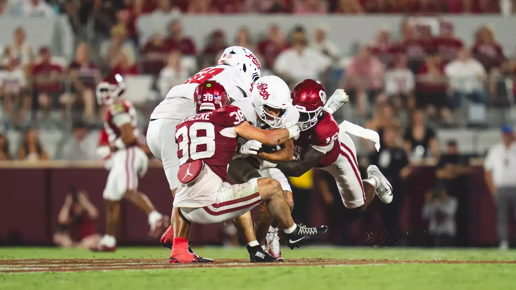 Oklahoma defenders Danny Okoye and Owen Heinecke on the field.
