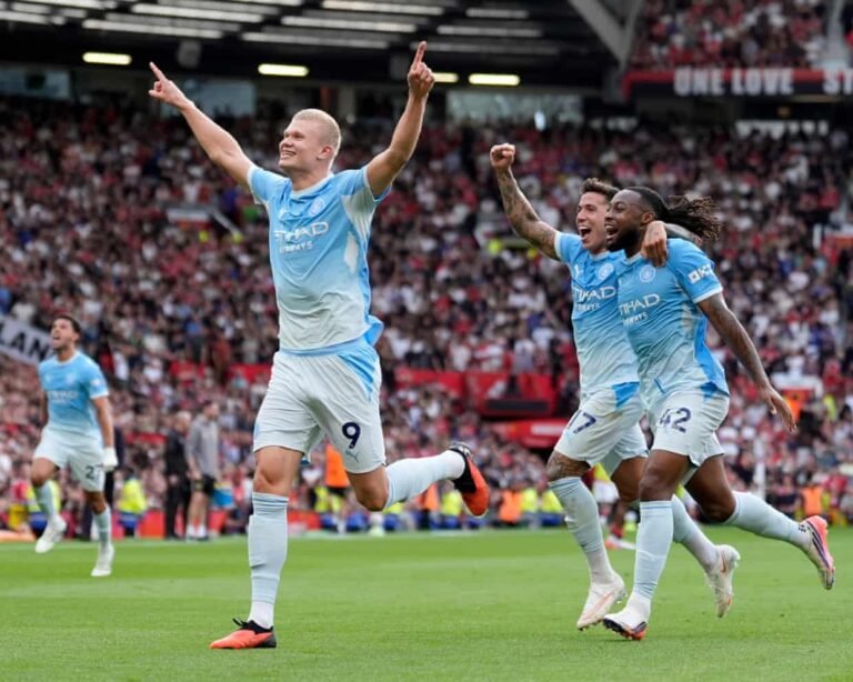 Erling Haaland celebrates after VAR awards his goal at Old Trafford.