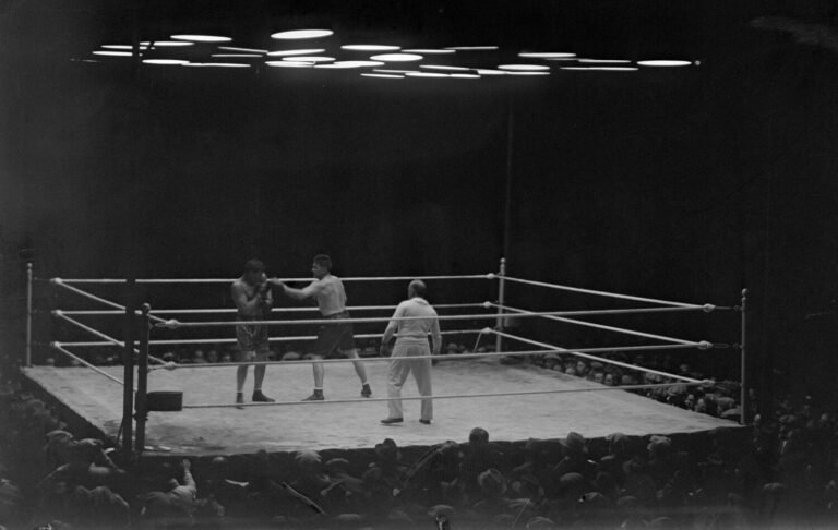 Gene Tunney jabs at Jack Dempsey during their 1926 championship fight.
