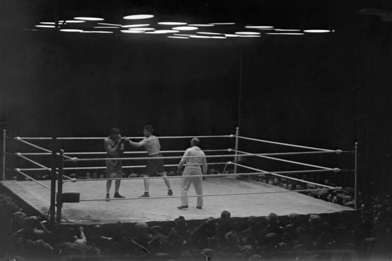 Gene Tunney jabs at Jack Dempsey during their 1926 championship fight.
