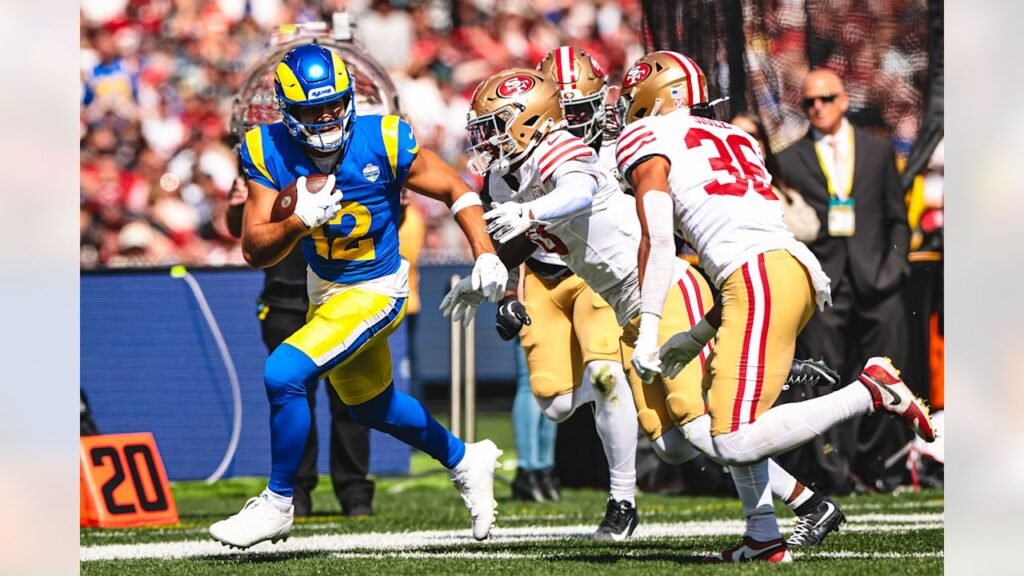 Puka Nacua carries the football against San Francisco in Melbourne.