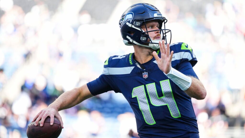 Sam Darnold warms up in a Seattle Seahawks uniform at Lumen Field.