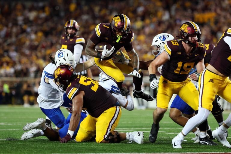 Darius Taylor carries the ball against Eastern Illinois.