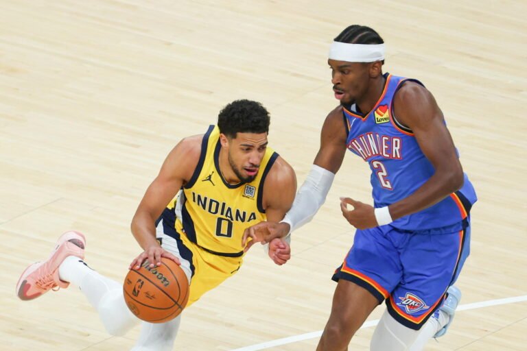 Tyrese Haliburton drives with the ball against Shai Gilgeous-Alexander.