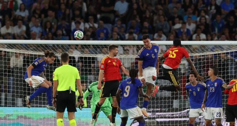 Italy and Belgium players contest a ball in front of goal in Rome.