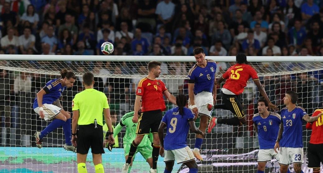 Italy and Belgium players contest a ball in front of goal in Rome.