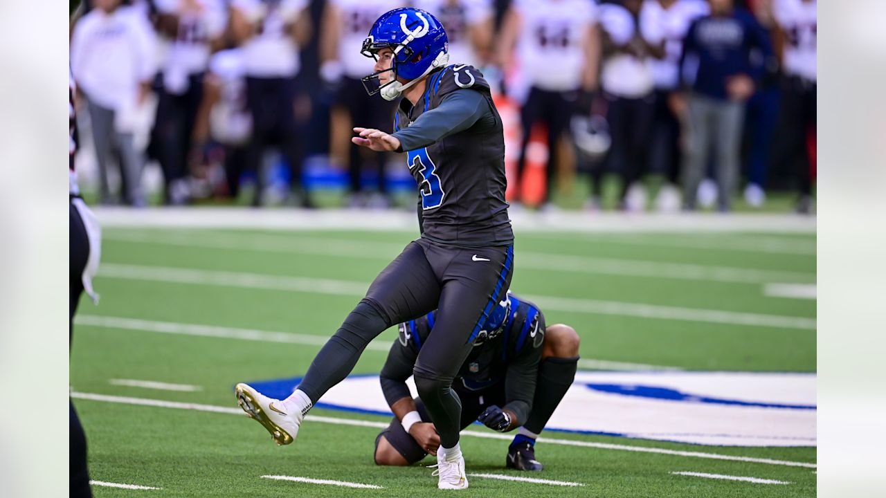 Colts kicker Spencer Shrader follows through on a kick with Rigoberto Sanchez holding.