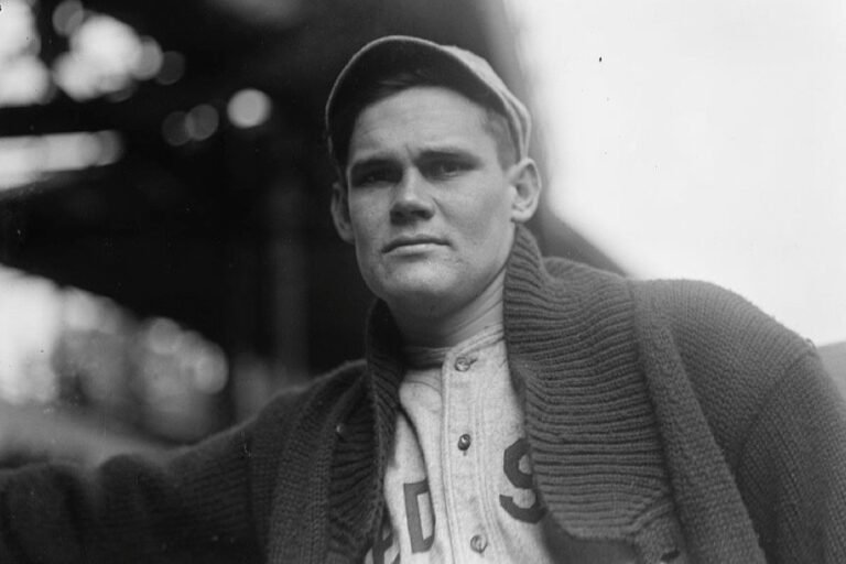 Dutch Leonard in a Boston Red Sox uniform and heavy sweater at a ballpark, circa 1914 or 1915