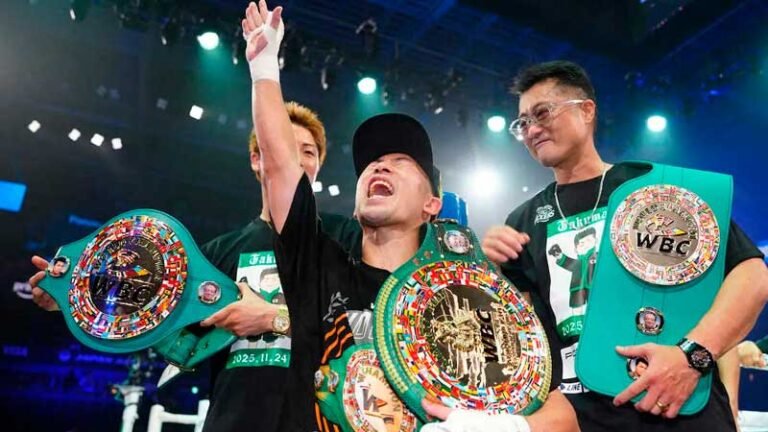 Takuma Inoue celebrates inside the boxing ring.