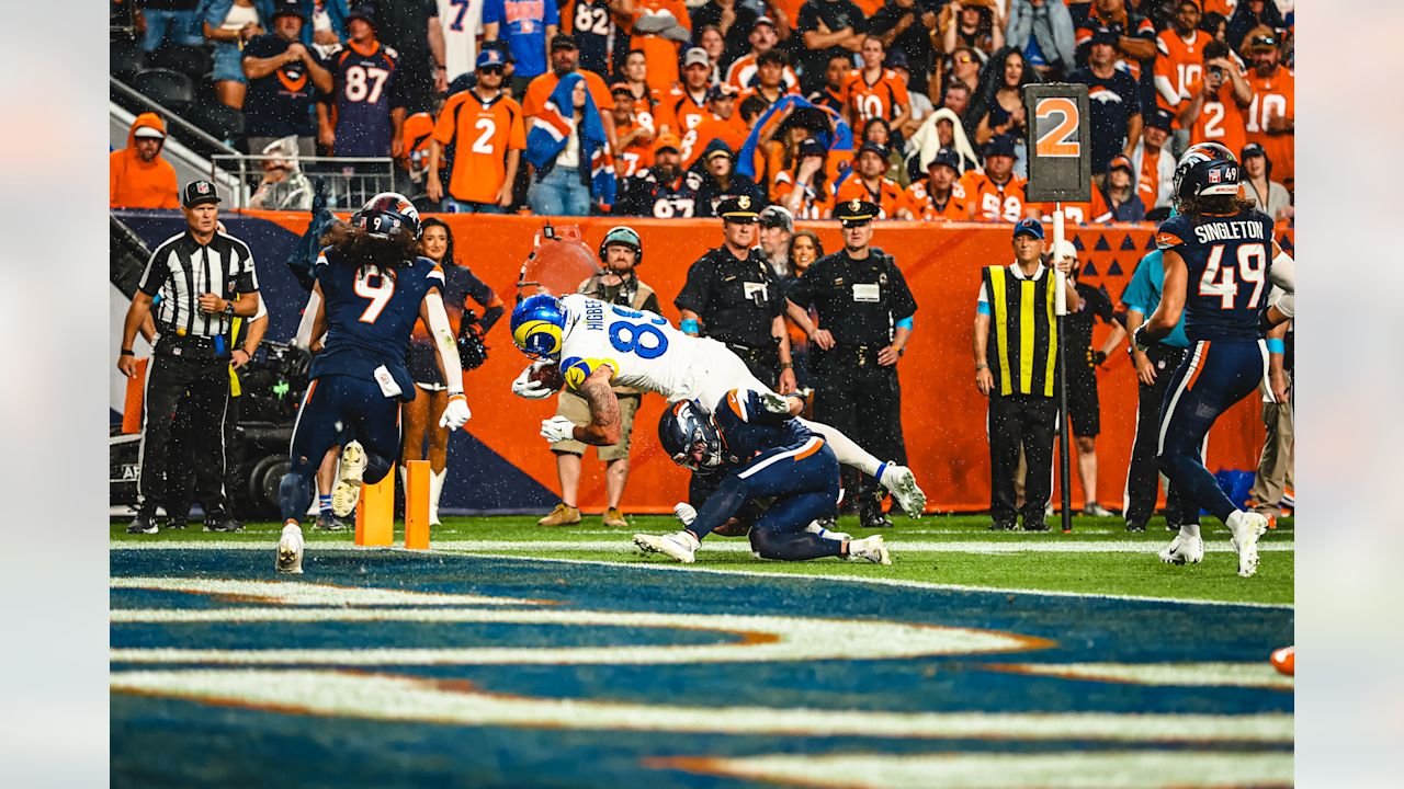 Tyler Higbee dives toward the goal line as Denver defenders tackle him during Rams–Broncos on September 27, 2026.
