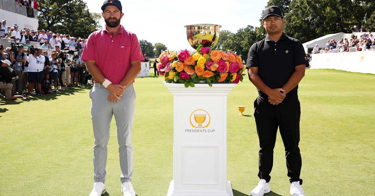 Cameron Young and Ryo Hisatsune pose beside the trophy before their Presidents Cup singles match at Medinah on September 27, 2026.