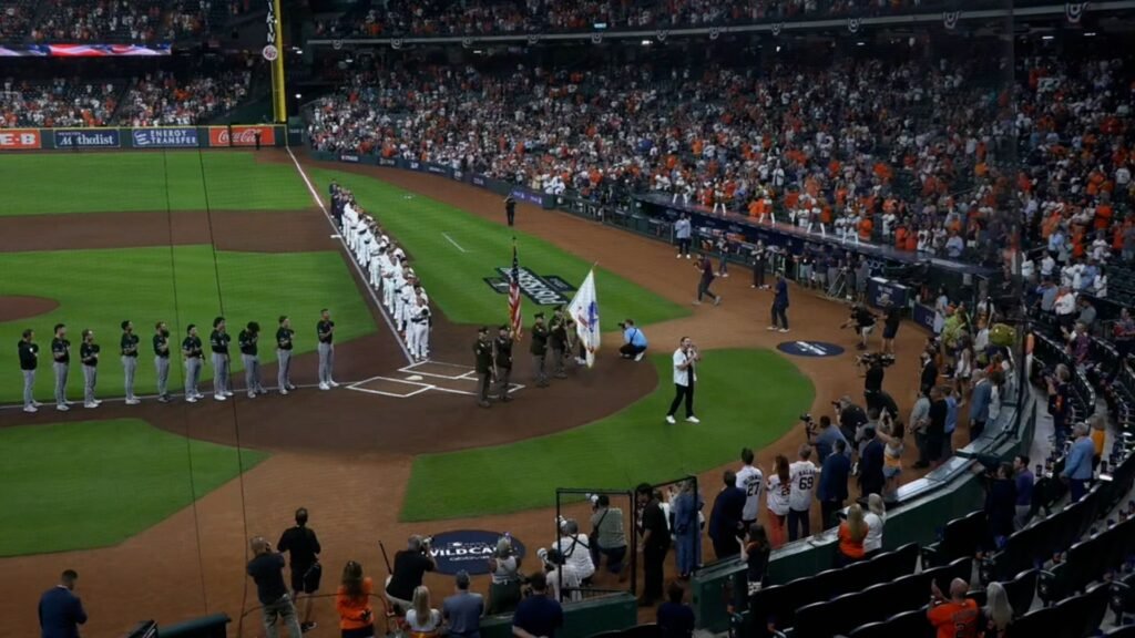 White Sox and Astros players line the field at Daikin Park for the national anthem before Wild Card Game 1 on September 29, 2026.