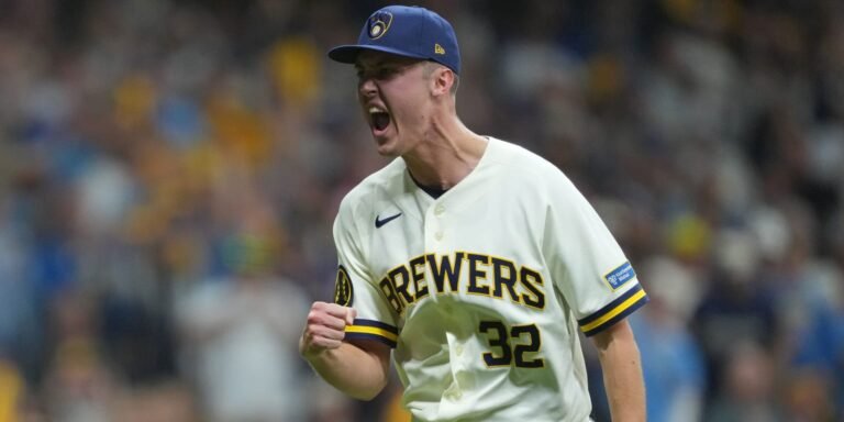 Jacob Misiorowski celebrates in a Milwaukee Brewers jersey.