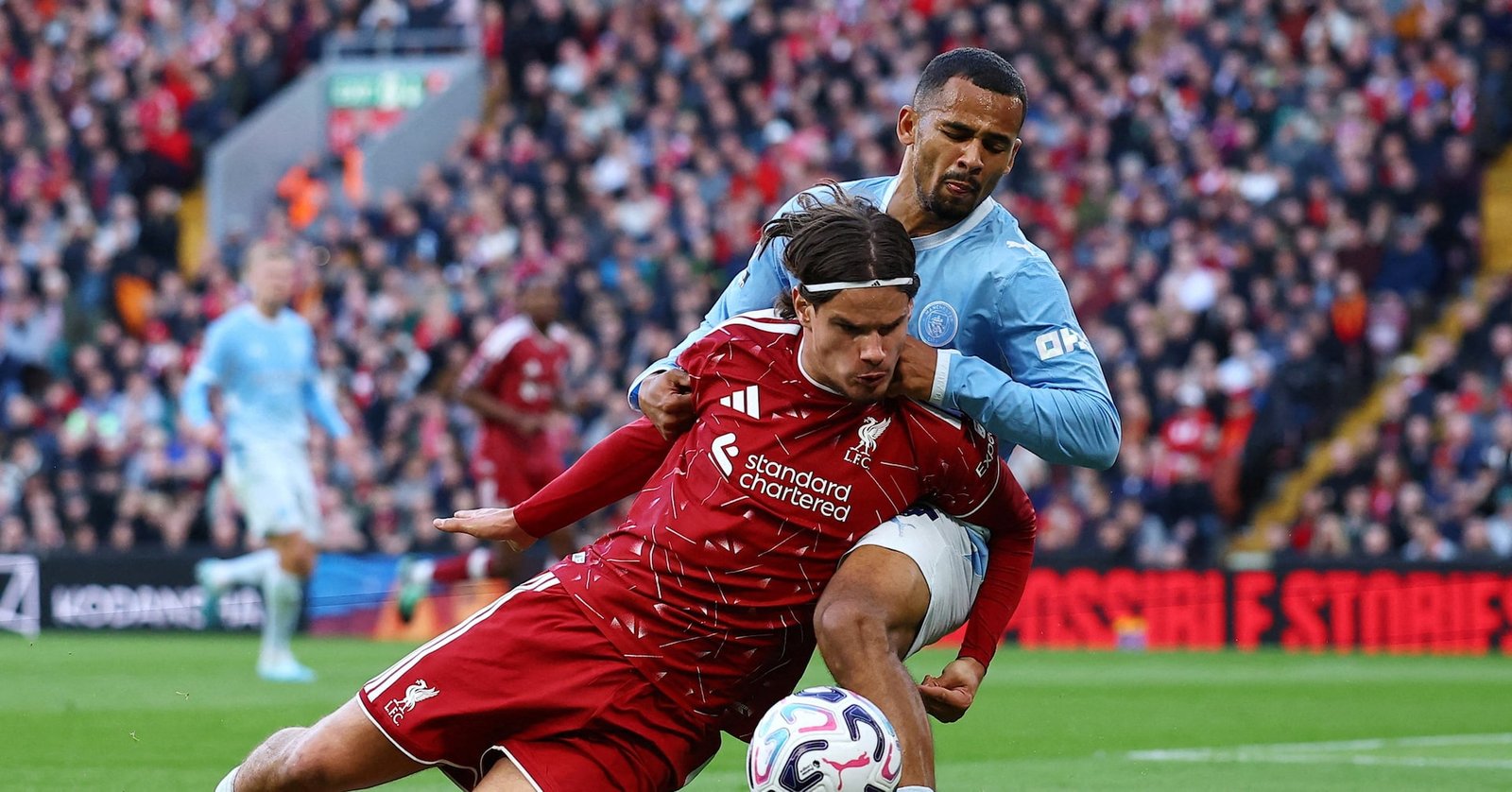 Liverpool’s Milos Kerkez challenges Manchester City’s Iliman Ndiaye at Anfield.
