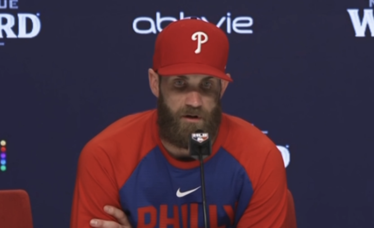 Bryce Harper in a Phillies cap at his postgame news conference.