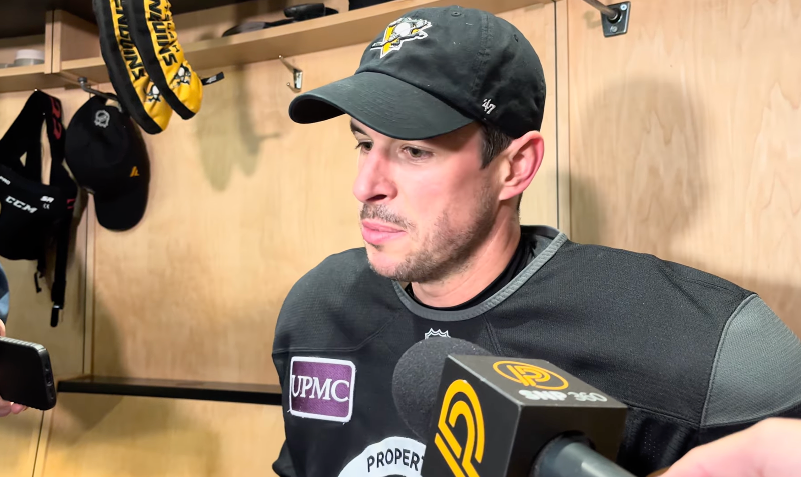 Sidney Crosby speaks to reporters in the Penguins’ locker room.