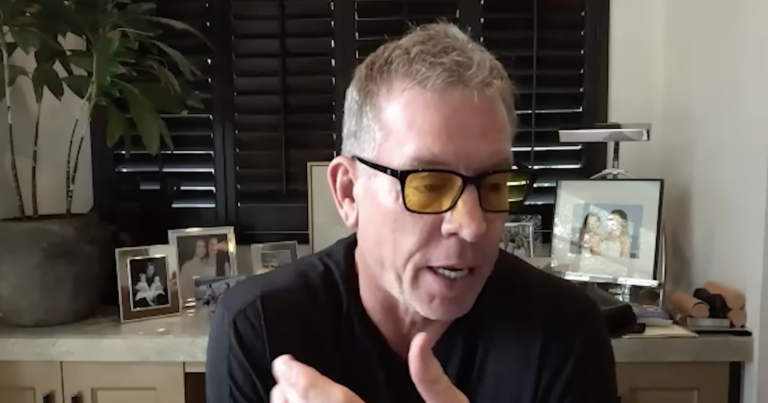 Troy Aikman wearing tinted glasses during his Rushmore Podcast appearance.