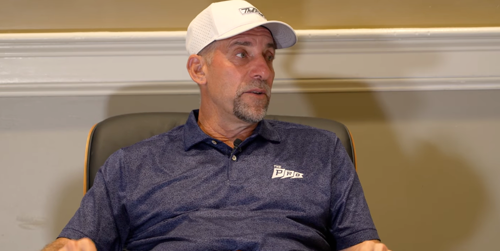 John Smoltz wearing a white cap and navy polo during his Brice Butler Studios interview.