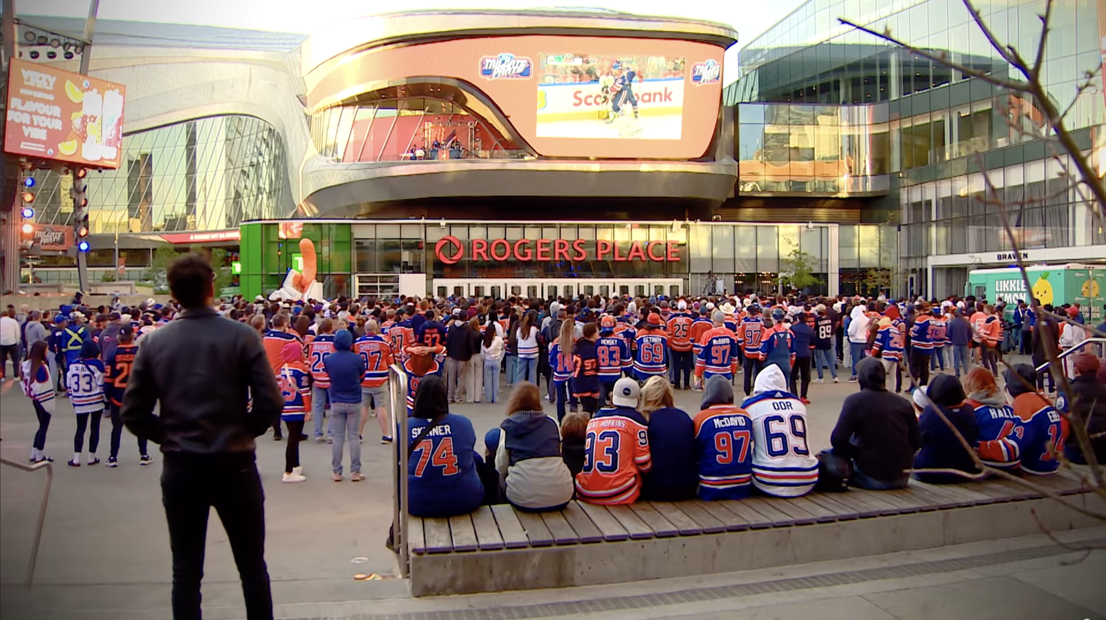 Oilers fans gather in ICE District outside Rogers Place to watch hockey on an outdoor screen
